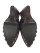 Alaïa Leather Studded Accents Mules