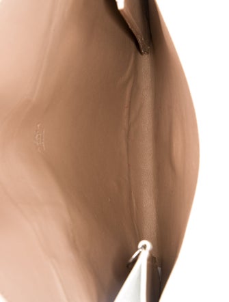 Alaïa Embossed Leather Clutch