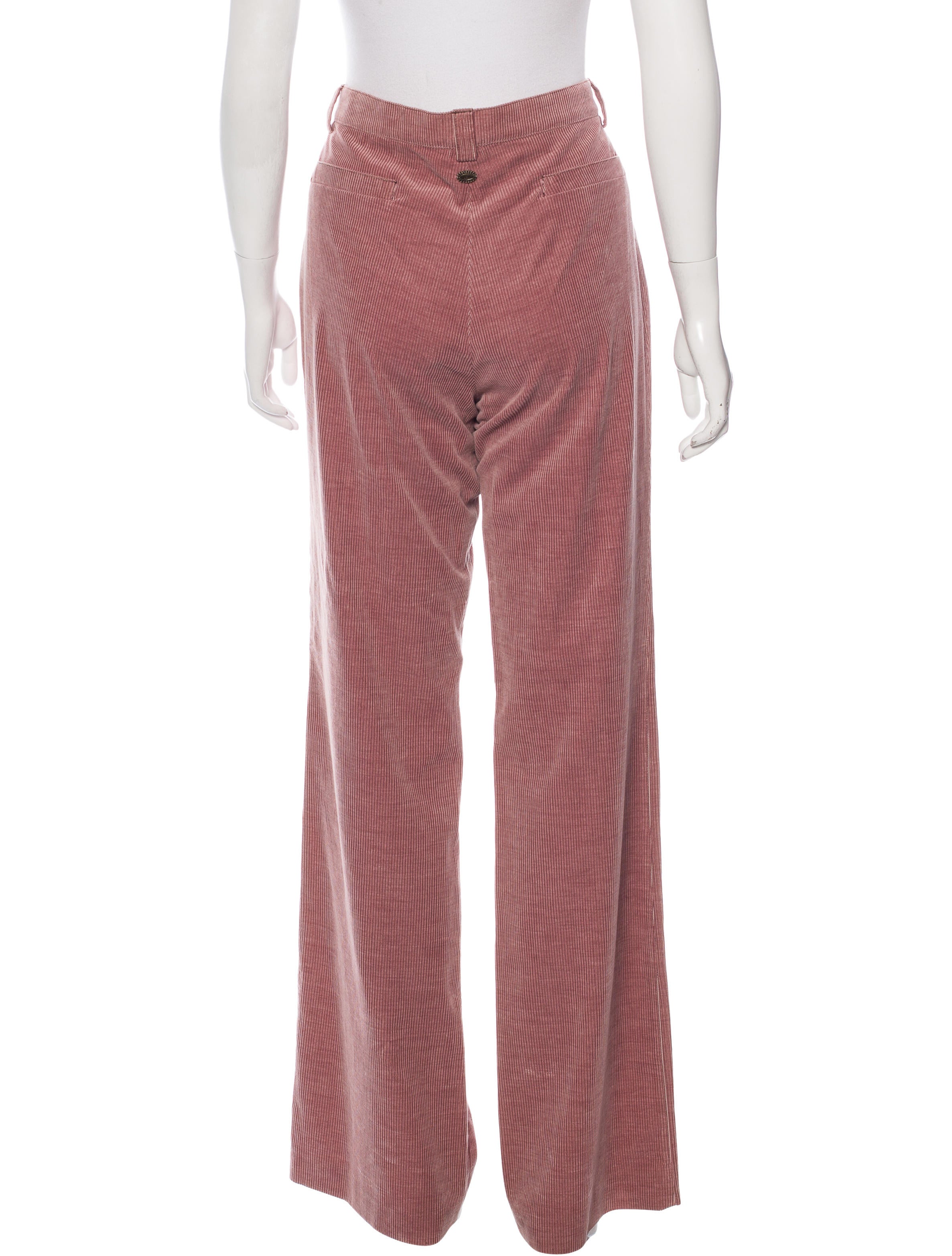 You're here High waisted corduroy pants with a wide fit leg that flares out. Detailed with front slant pockets and patch pockets at the back. Length of inseam: 73cm /