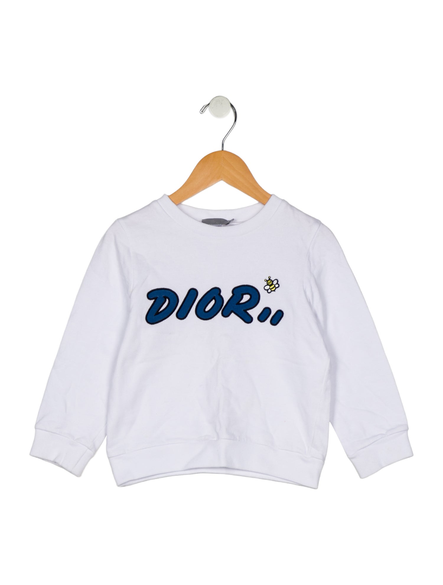 Christian Dior girls' white pullover with sewn patches.