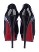 Christian Louboutin Patent Leather Pumps