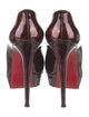 Christian Louboutin Patent Leather Animal Print Pumps