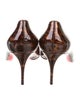 Christian Louboutin Patent Leather Animal Print Pumps