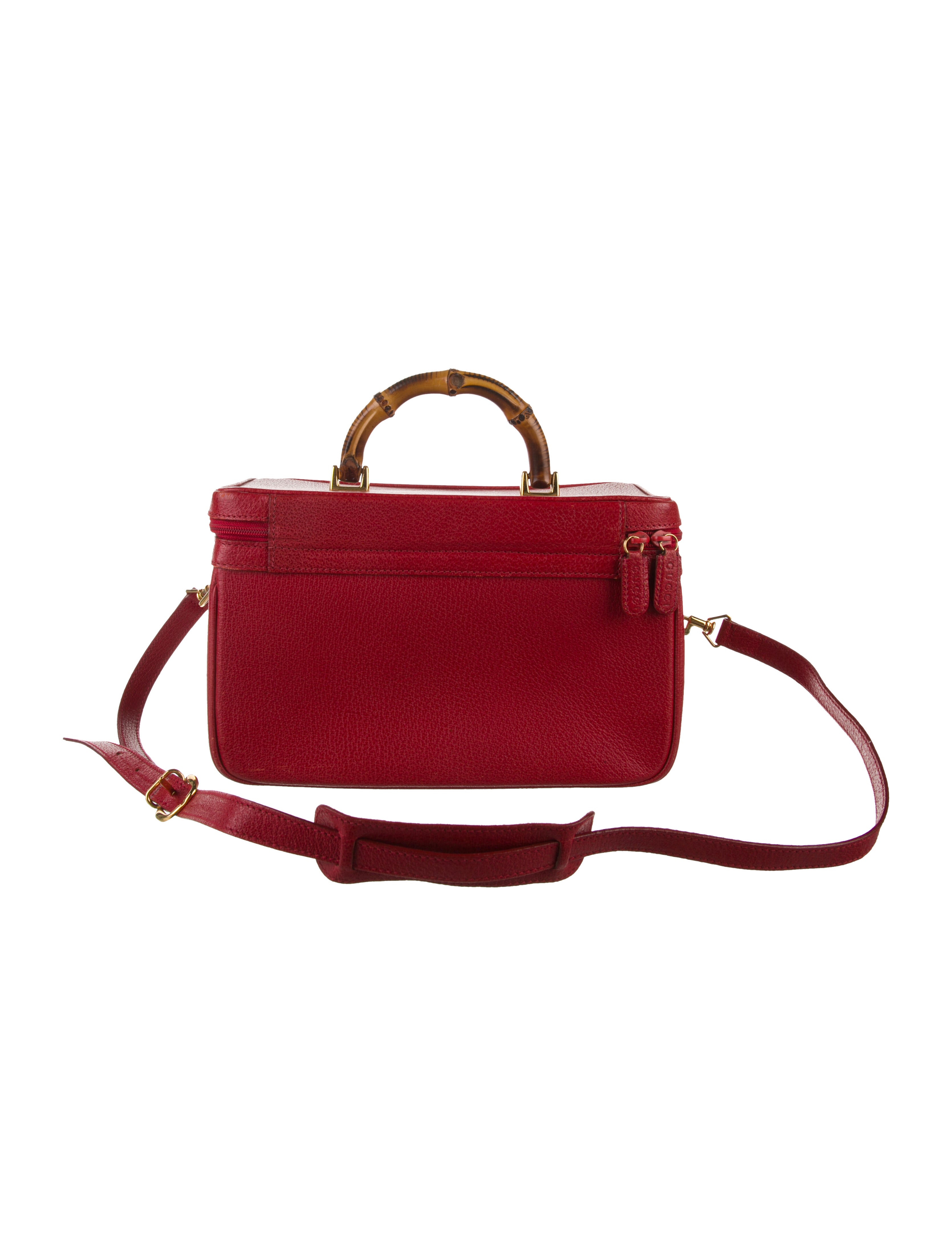 Gucci women's red leather cosmetic bag with bamboo handle