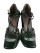 Miu Miu Patent Leather Cutout Accent T-Strap Pumps