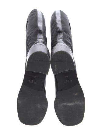 Prada Enameled Metal Triangle Boots