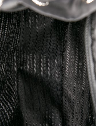 Prada Enameled Metal Triangle Backpack