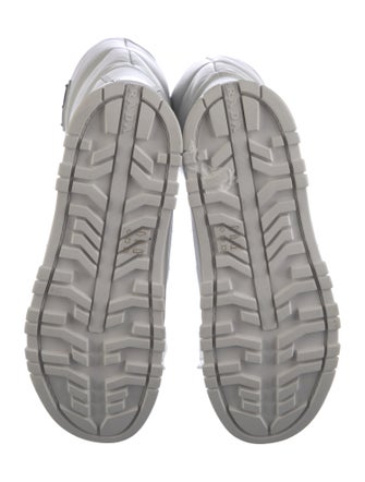 Prada Enameled Metal Triangle Leather Boots