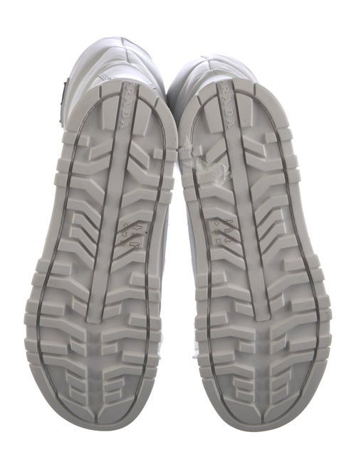 Prada Enameled Metal Triangle Leather Boots