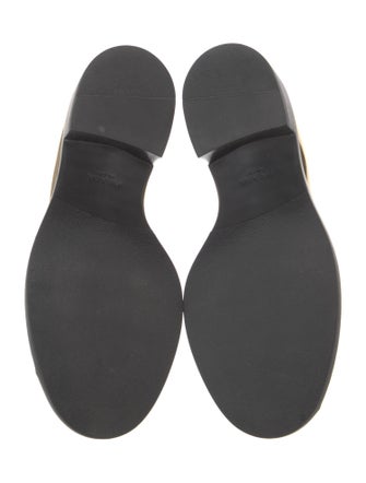 Prada Enameled Metal Triangle Patent Leather Loafers