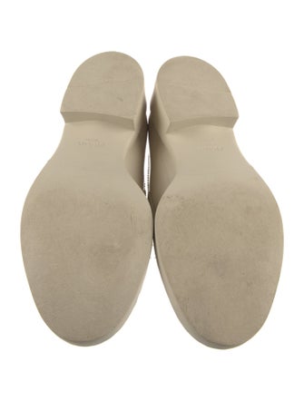 Prada Enameled Metal Triangle Patent Leather Loafers