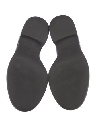 Prada Enameled Metal Triangle Patent Leather Loafers