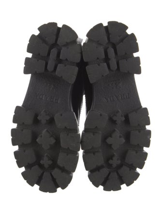 Prada Enameled Metal Triangle Leather Combat Boots