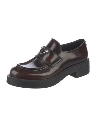 Prada Enameled Metal Triangle Patent Leather Loafers