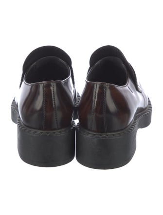 Prada Enameled Metal Triangle Patent Leather Loafers
