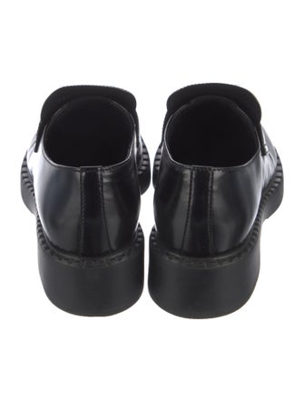 Prada Enameled Metal Triangle Leather Loafers