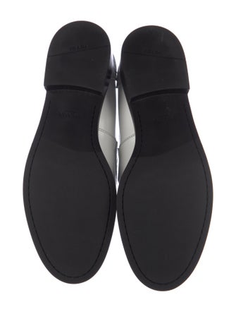 Prada Enameled Metal Triangle Leather Loafers