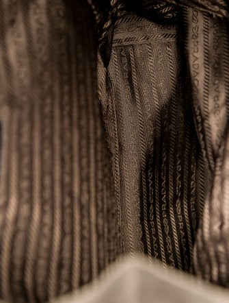 Prada Enameled Metal Triangle Backpack