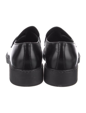 Prada Enameled Metal Triangle Leather Loafers