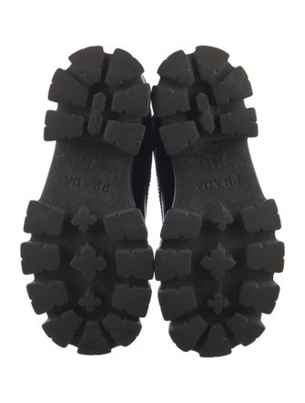 Prada Enameled Metal Triangle Leather Combat Boots