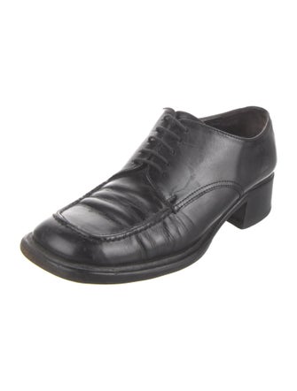 Prada Enameled Metal Triangle Leather Mules