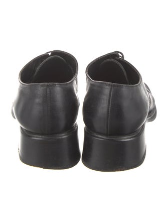 Prada Enameled Metal Triangle Leather Mules