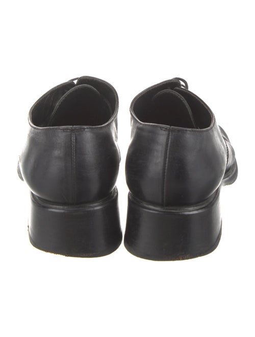 Prada Enameled Metal Triangle Leather Mules