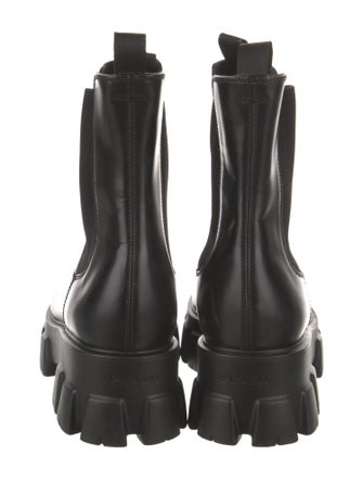 Prada Spazzolato Rois Monolith Enameled Metal Triangle Chelsea Boots