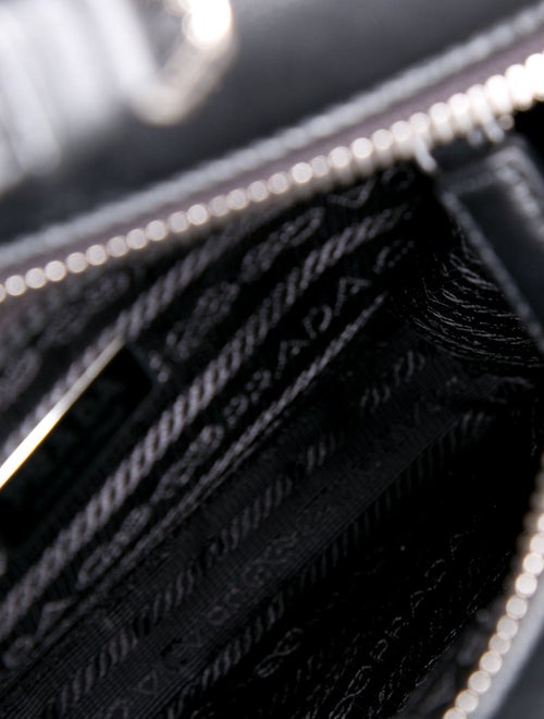 Prada Enameled Metal Triangle Triangle