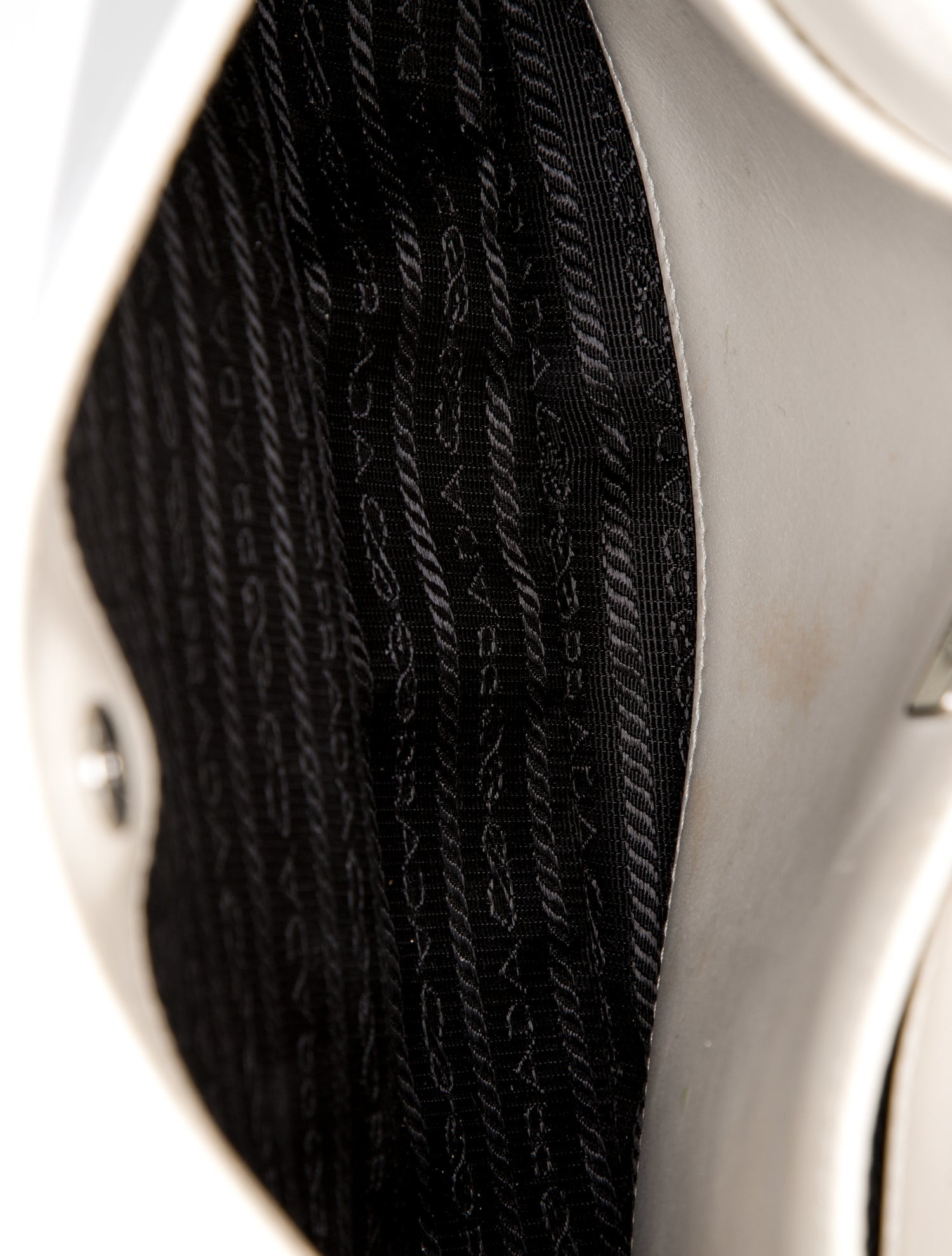 Prada Enameled Metal Triangle Cleo