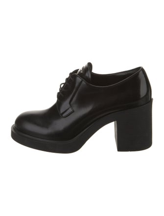 Prada Enameled Metal Triangle Patent Leather Pumps