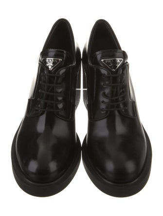 Prada Enameled Metal Triangle Patent Leather Pumps