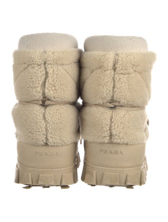 Prada Enameled Metal Triangle Shearling Lace-Up Boots
