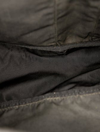 Prada Enameled Metal Triangle Backpack