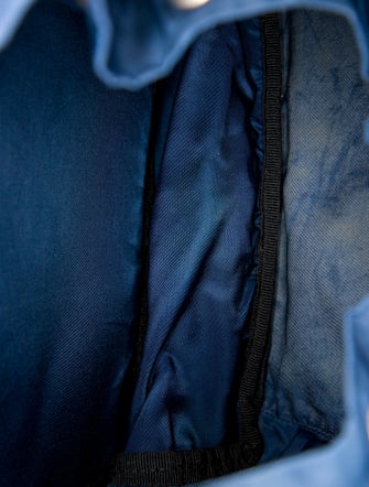 Prada Enameled Metal Triangle Backpack