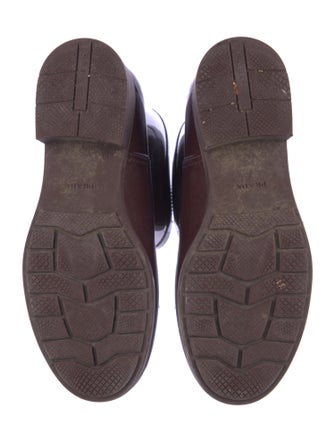 Prada Enameled Metal Triangle Rubber Rain Boots