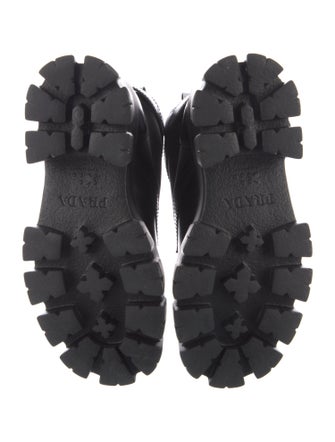 Prada Enameled Metal Triangle Leather Combat Boots