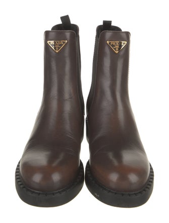 Prada Enameled Metal Triangle Leather Chelsea Boots