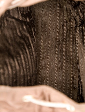 Prada Enameled Metal Triangle Backpack