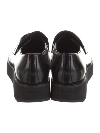 Prada Enameled Metal Triangle Patent Leather Loafers