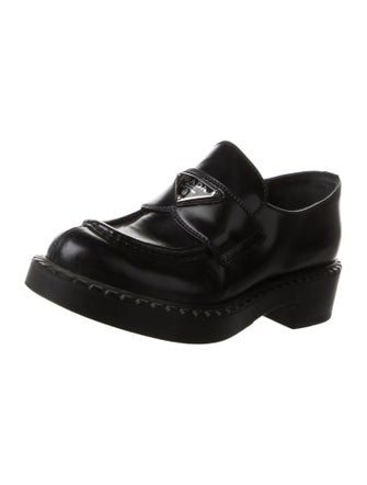 Prada Enameled Metal Triangle Patent Leather Loafers