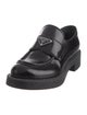 Prada Enameled Metal Triangle Leather Loafers