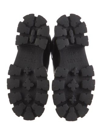 Prada Enameled Metal Triangle Leather Combat Boots