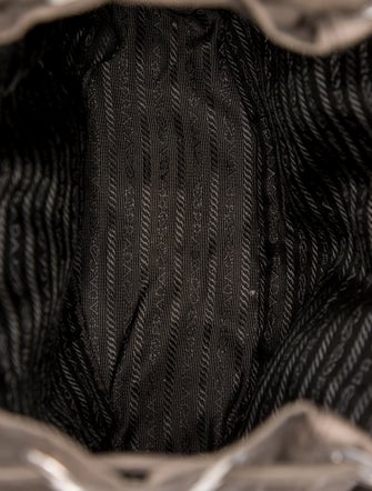 Prada Enameled Metal Triangle Backpack