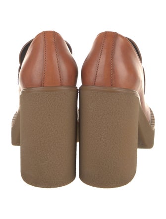 Prada Enameled Metal Triangle Leather Pumps