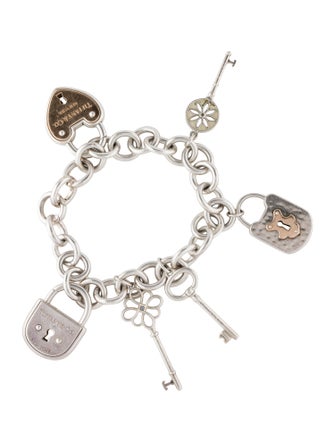 Tiffany & Co. Diamond & Sapphire Accented Keys & Locks Charm Bracelet