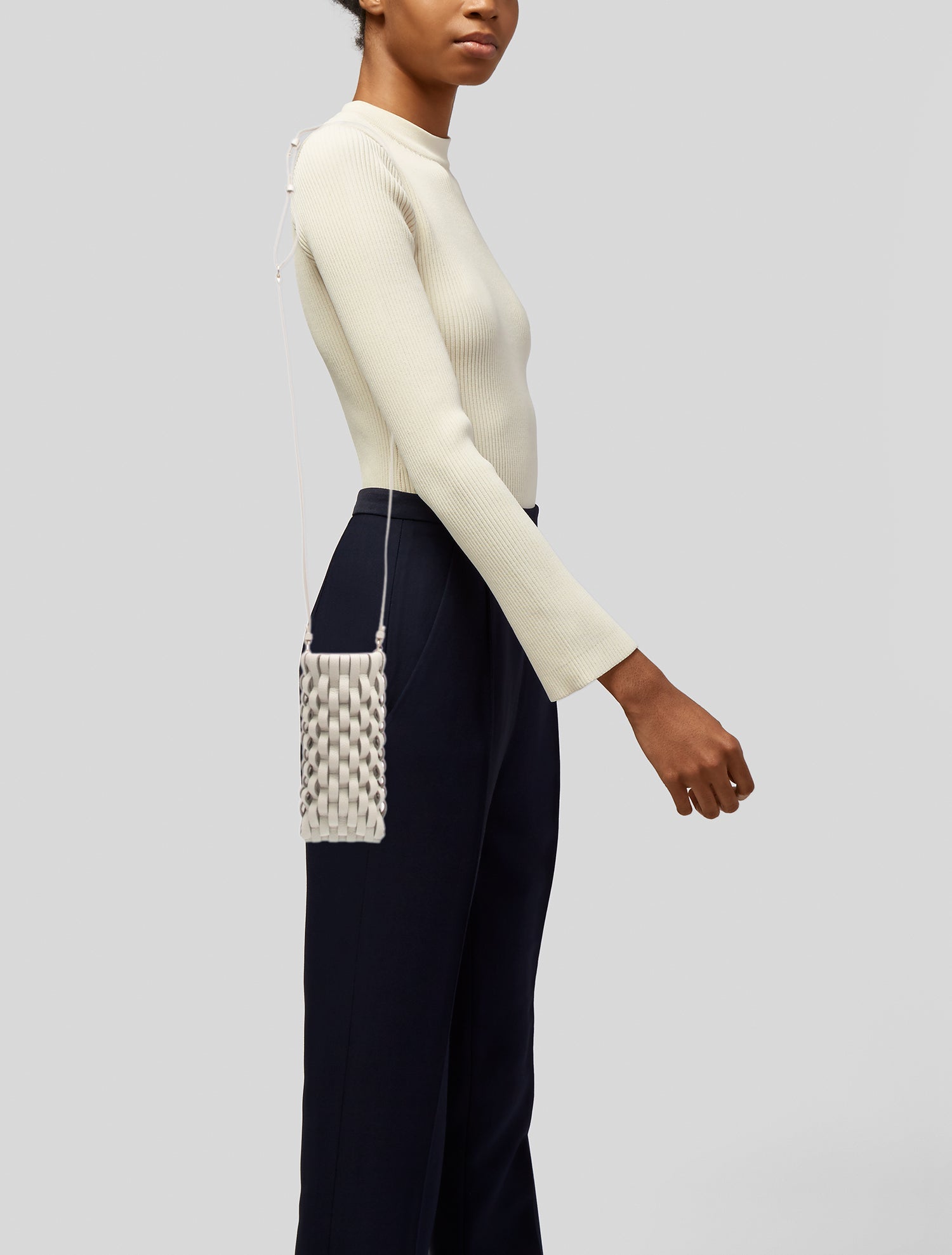 Polène leather woven phone holder with card slots
