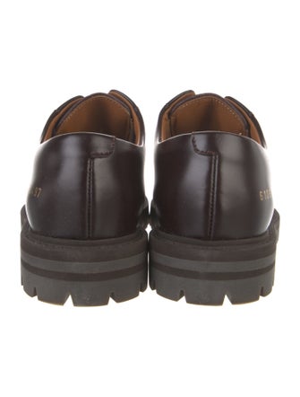 Woman by Common Projects Leather Mules