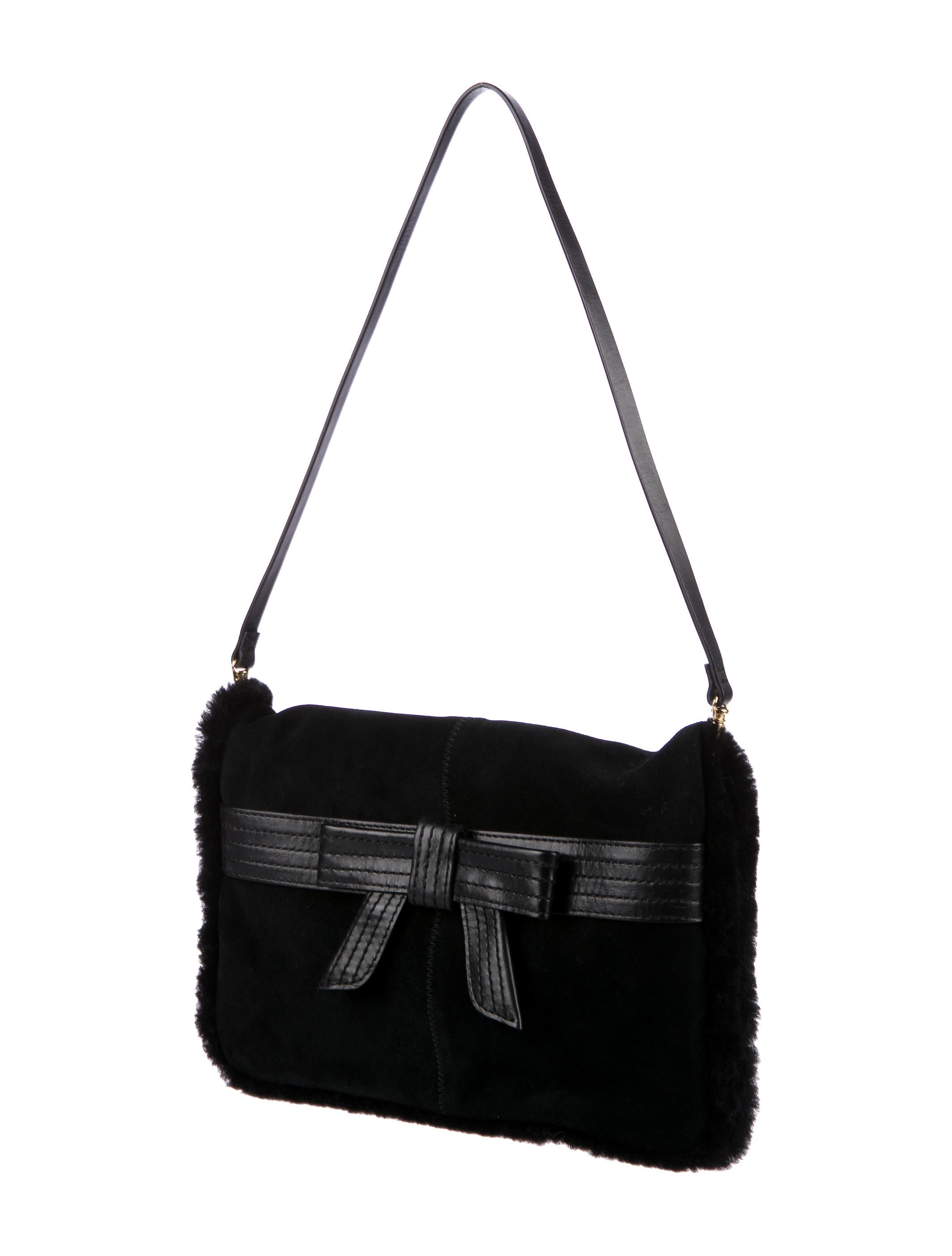 Shop by category ⭐ UGG Australia ⭐ Black Genuine Leather Shoulder Bag / Clutch This UGG Australia shoulder bag features gold tone hardware, adjustable shoulder strap ( drop), which can also be removed and turn into a clutch bag, and front Zip.