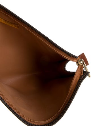 Yves Saint Laurent Womens knit cosmetic bag with zip closure.